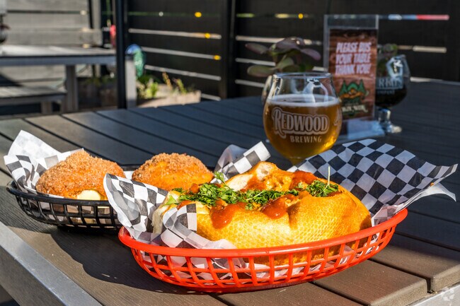 Grab a delicious chicken sandwich a cold beer on tap from Redwood Curtain Brewing Company.