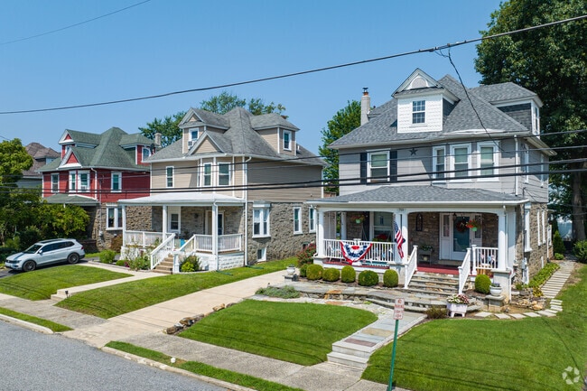 Picturesque Victorian style homes in Glenolden with attached driveways.