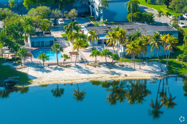 A beach and outdoor pool in the Fountainbleau East community.
