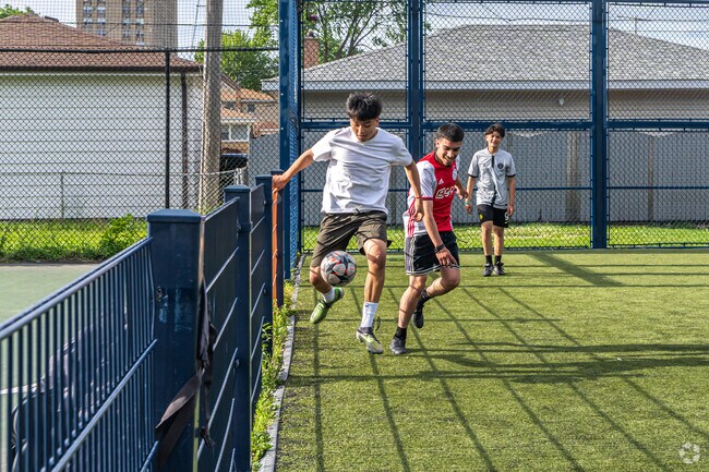 Crafty players make use of the fence at the soccer field in Rainey Park.