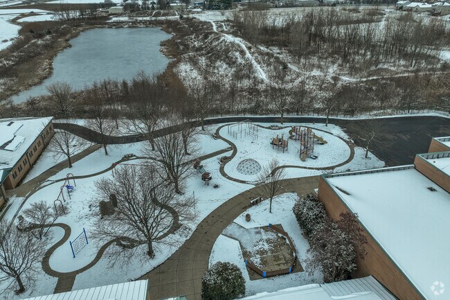 Kaneland John Stewart Elementary School has a playground covered in snow.