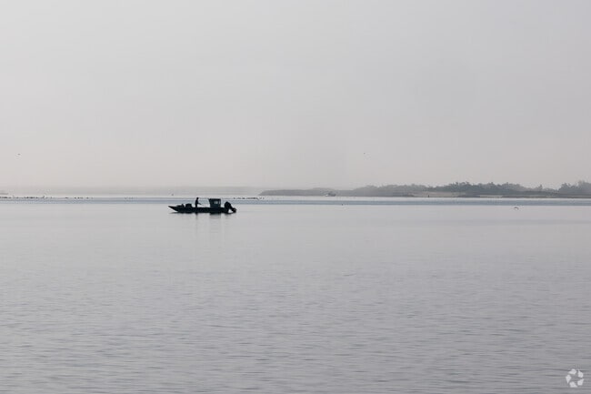 People can be found fishing in the bay in East Moriches early in the morning.