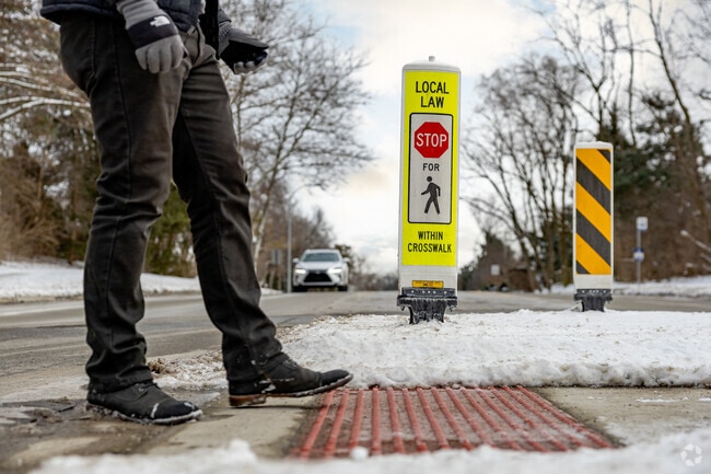 Main roads in Narrow Gauge Woods have plentiful safety-conscious pedestrian crossings.