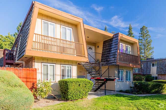 An older Walden apartment building with a shingle roof.