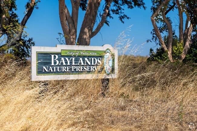 Wood sign at Baylands Nature Preserve stands out against golden grass.