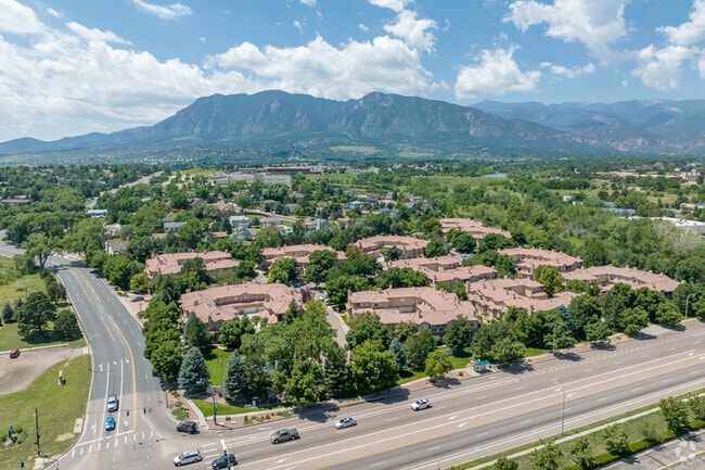 The Cheyenne Hills neighborhood is surrounded by lush greenery and mountains.