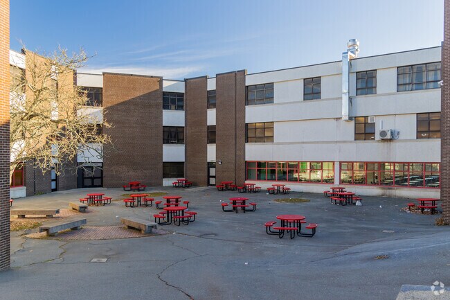 New Bedford High School scores a B on Niche and has a 14:1 student-teacher ratio.