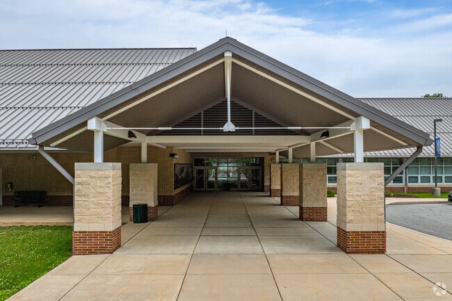 Life long learners pass through the front doors of West Vincent Elementary School.