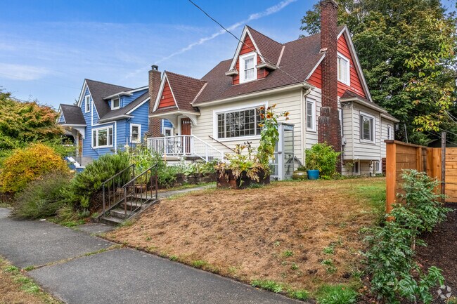 Mann homes have well-kept front yards and colorful trees.