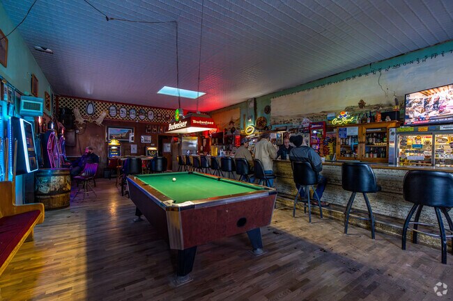 Belfry Bar features a pool table and slot machines.