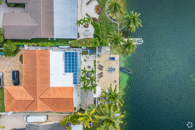 Wake up to a beautiful lakeside view at Olympia Heights, FL.