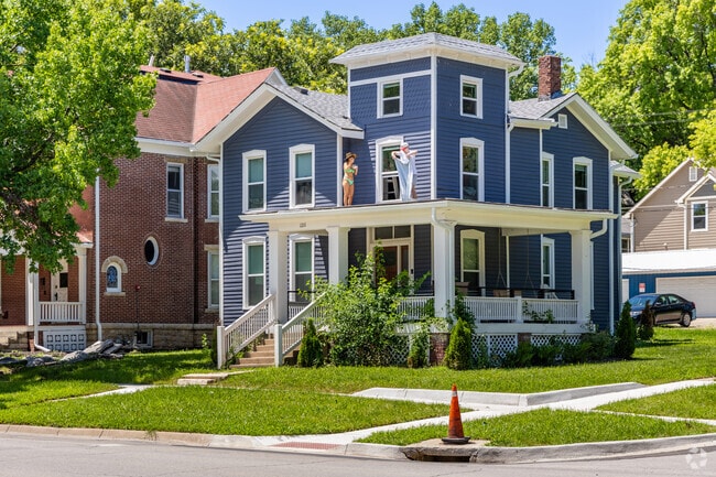 Sunbathing on rooftops is common in University Place, Lawrence.
