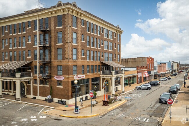 Many business in historic buildings like Redlands Hotel, line the streets of Palestine.