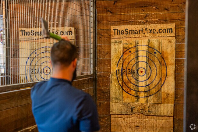 A man aims for the bullseye with a hatchet from Smart Axe in Village One, Modesto.