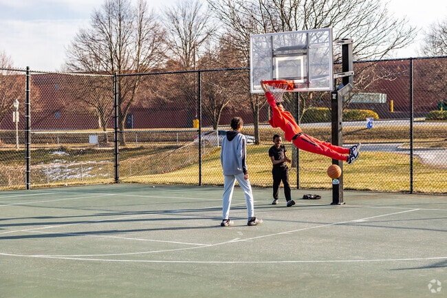 Locals in Frederick Heights/Overlook play pickup games on the courts at Tasker's Chance Field.