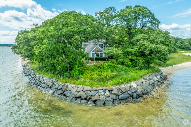 Find your forever home in isolation and solitude in Eaton's Neck, with waterfront views.