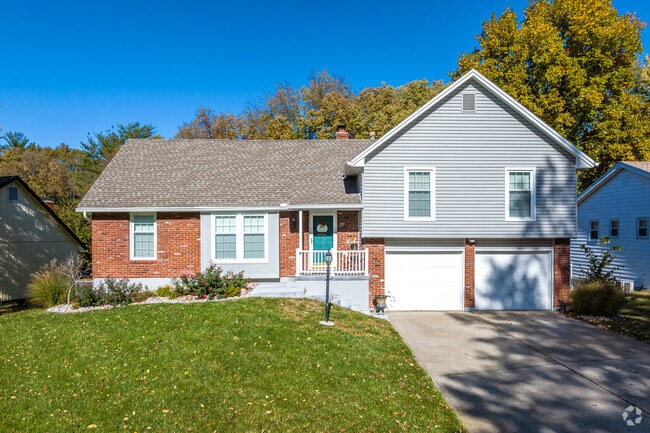 Split-level homes line the tree shaded and hilly streets of Parkville.
