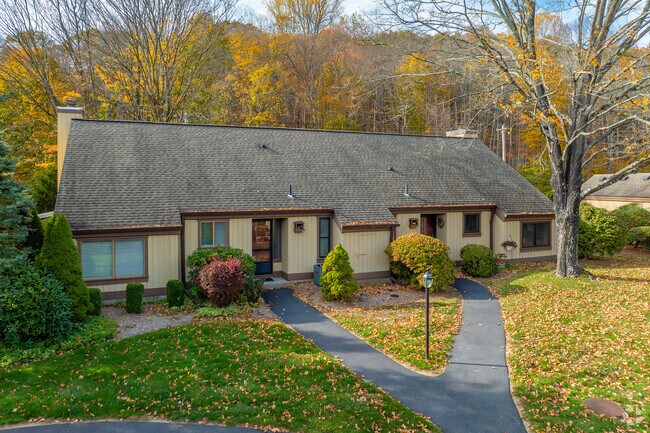 Homes and winding streets nestle among wooded hills in Somers.