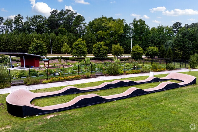 A pop up pump track sits in a field at Carpenter Park in Southwest Morrisville NC.