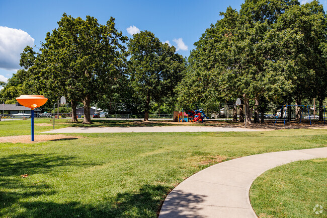 Children at Billings Elementary School enjoy recess in a shaded playground.