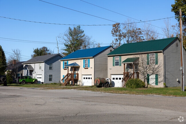 Two story family homes with car garage is a popular housing option in New Richmond neighborhood.
