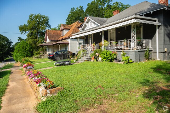 Many mill homes have brick bed planters in the front yard.