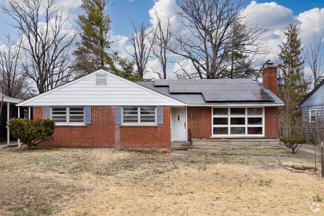 Harness the sun in this cozy brick ranch with solar panels in Carbondale.