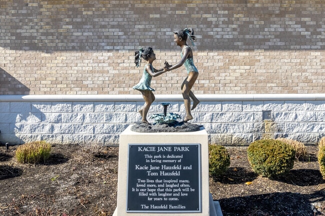 A sculpture at Kacie Jane Park in Clearcreek Township is a memorial to the Housfeld family.