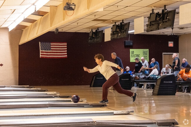 Residents of Braeburn Heights gather at Slocum's Bowling, Bar, and Grille for an epic tournament.