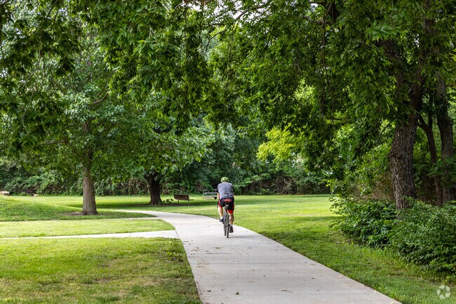 Locals enjoy bike rides through the winding paved trails at Shunga Glen Park.