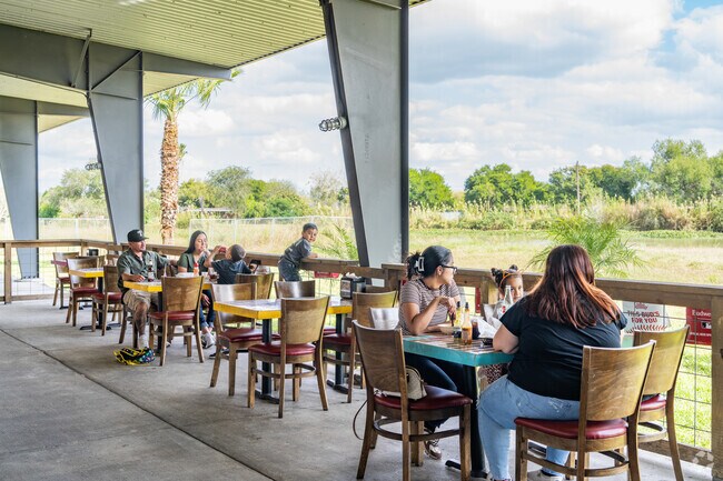 Calacas Tacos & Beer located in San Benito has an outdoor dining area overlooking the river.