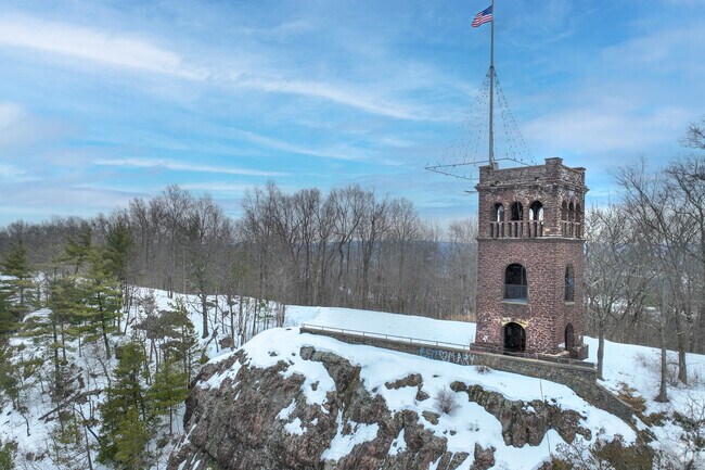 Through the arches at the top of the historic Poet's Seat Tower, visitors can take in breathtaking views of Greenfield and the stunning Pioneer Valley below.