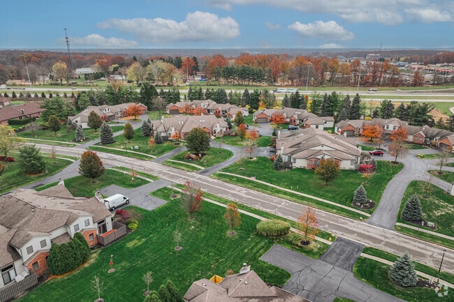 Subdivisions, bisected by main roads, are common throughout Canfield.