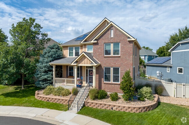 Brick Craftsman-style homes in Quail Ridge-Adams have well-manicured lawns.