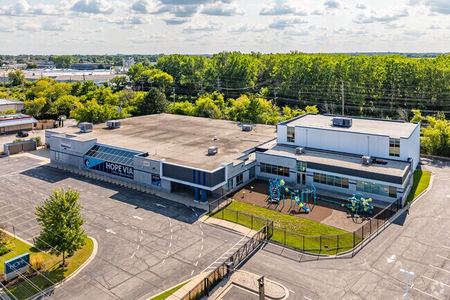 Mature trees surround the campus at Racine's Hope Christian School - Via.