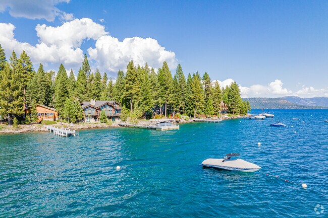 Boats are moored on buoys on the coast of Carnelian Bay.
