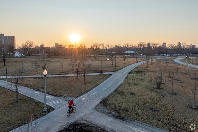 As the sunsets a biker races home along Oaklands Lake Front Trail.