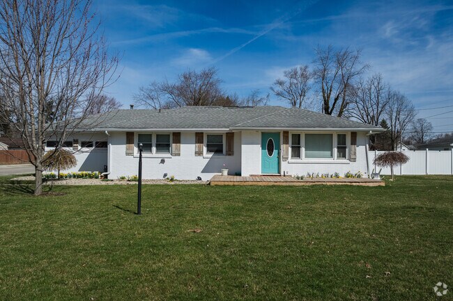 This Halteman ranch home features a beautiful blue door.