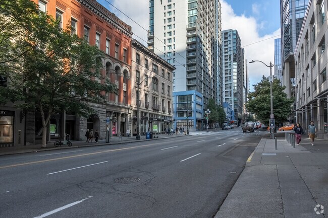 Condos and storefronts line 1st Avenue, offering housing options in Downtown Seattle.
