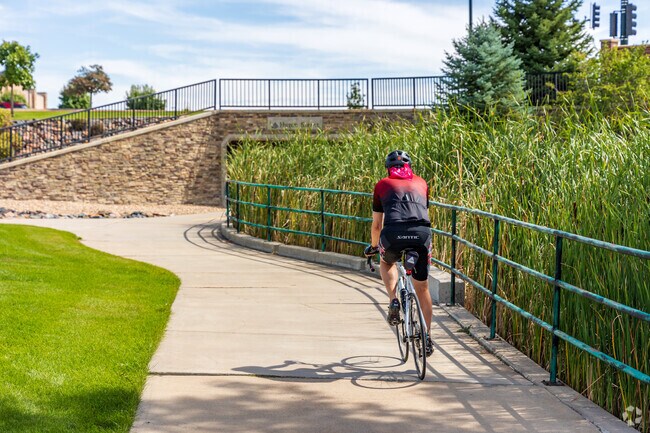 Cyclists enjoy scenic paved paths throughout Huntington Trails.