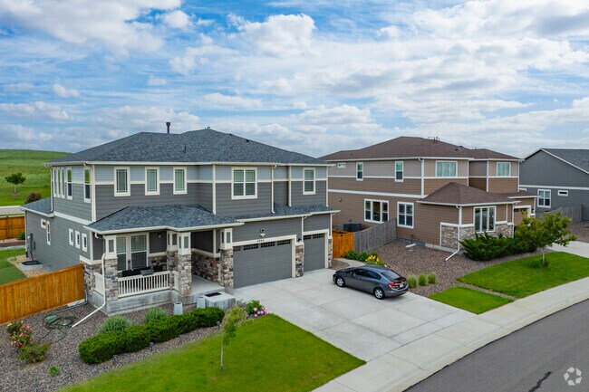 Homes with spacious yards in Lewis Pointe in Thornton, Colorado, make room for family barbecues, laughter-filled games of catch, and the simple joys of outdoor living.