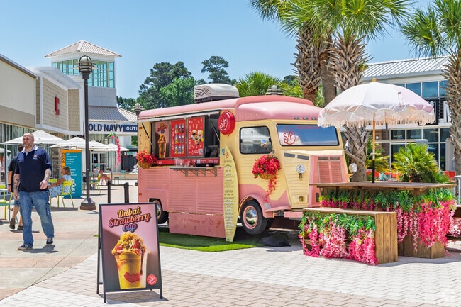 Sip offers tropical drinks and sweet treats steps from Grande Dunes shopping spots.