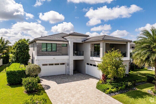 A modern, four car garage home in the Lotus neighborhood.