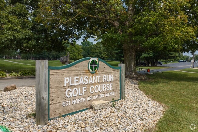 Golfers practice their swing at the Pleasant Run Golf Course on Arlington Ave near Eastside.