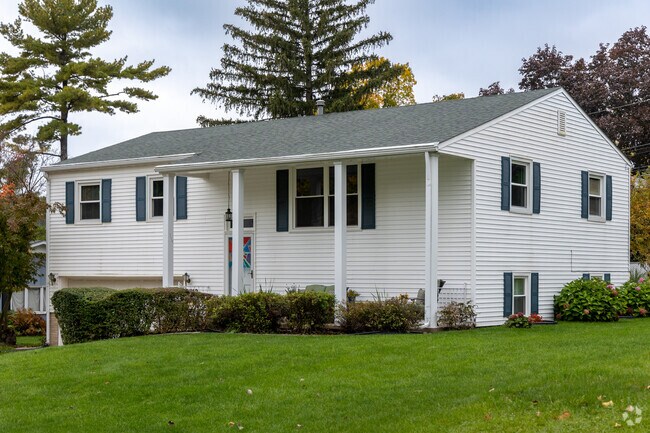 This colonial-style home in Blackhawk features a large yard and a two-car garage.