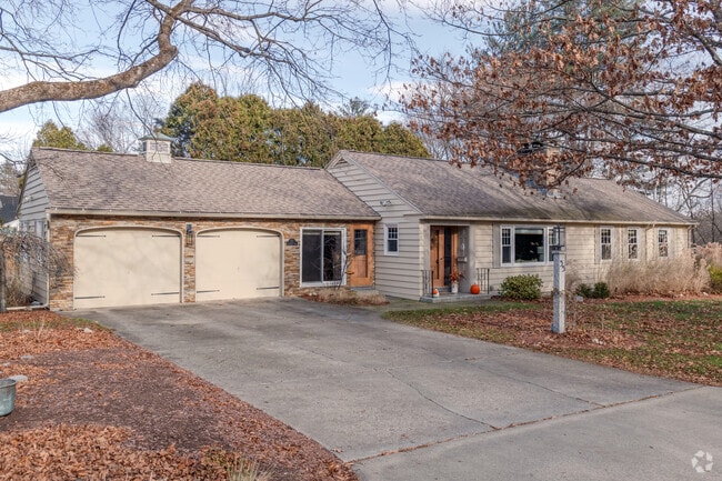 A ranch home in Florence with double garage doors.