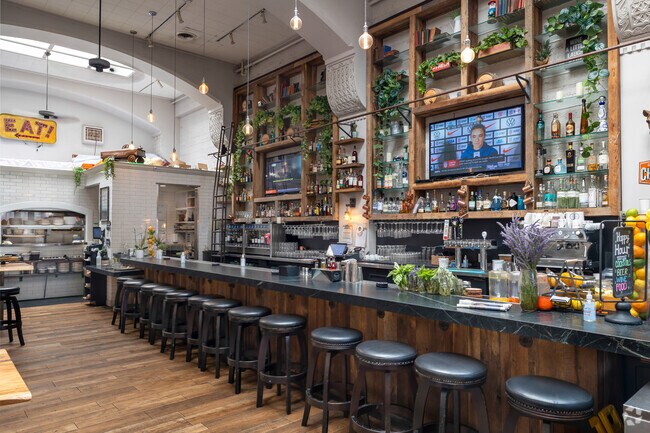 Teeming with plants and black and wood details, Local Union 271 is a beautiful place to grab a b