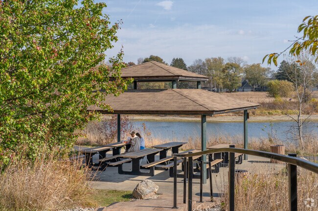 At Beckenholdt Park, locals come to relax by the water and have a picnic under a pavilion.