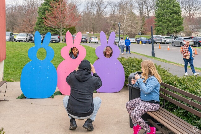 Grab a photo posing as bunnies in Peddlers Village with family for Peeps in the Village.