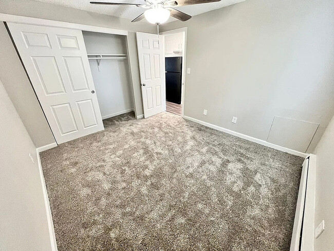 Experience comfort and style in this spacious bedroom, tailored for relaxation.